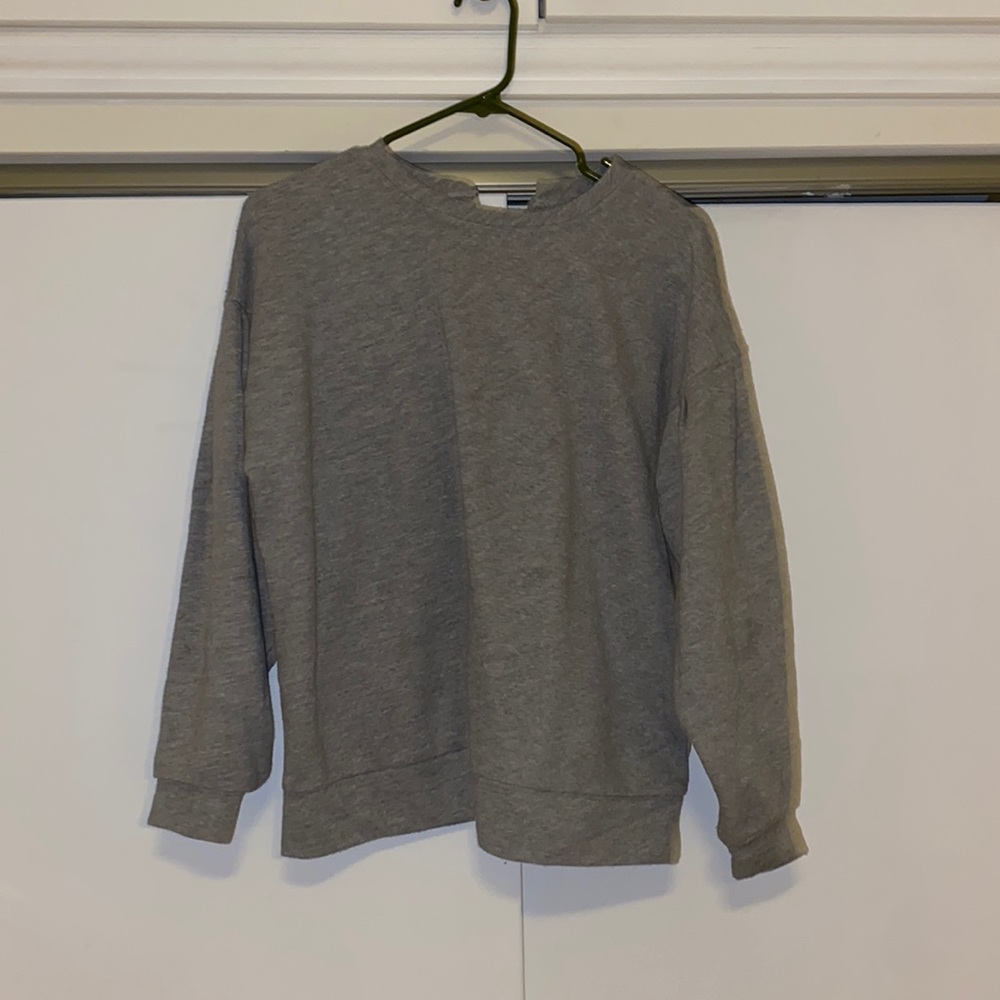 Sweater with bow tie cross in back